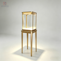 Vitrine moderne en verre et acier inoxydable avec éclairage LED et design rotatif pour magasin de détail
