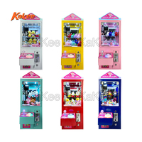Machine populaire de grue à griffes à jetons pour la mini machine de grue d'arcade de peluches de pendentifs en peluche pliables