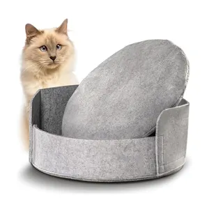 Venta al por mayor personalizado calmante cama de fieltro para mascotas suave redonda lavable gato cesta casa con fondo antideslizante