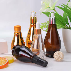 Vente en gros flacon compte-gouttes cosmétique ambré de luxe de 100ml contenants cosmétiques pour soins de la peau et emballage bouteille en verre d'huile marocaine - Product Image 1