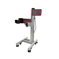 Machine de marquage laser CO2 automatique haute vitesse YAOMATEC 40W pour la date d'expiration, le code de lot et le numéro sur les sacs en plastique et les bouteilles