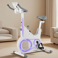 Vélo d'exercice à domicile blanc avec transmission par courroie magnétique, support pour tablette et porte-gobelet pour un entraînement cardio confortable en intérieur
