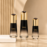 Ensemble de flacons et pots cosmétiques en verre noir dégradé de luxe avec bouchon doré brillant pour sérum et crème de soin
