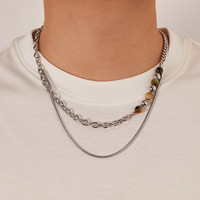 Collier élégant à double chaîne à maillons, en acier inoxydable, avec pierre œil de tigre, sans décoloration, avec pendentif pompon, pour femme