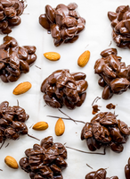 Nouvelle machine à déposer des grappes de noix enrobées de chocolat multifonctionnelle en acier inoxydable alimentée par prise électrique pour usage en boulangerie