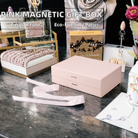 Individuelle Rosa Magnetische Klappbare Geschenkboxen aus Hartpappe mit Goldfolie Matt-Laminierung Prägung Faltbares Design und Band