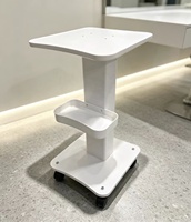 Chariot de rangement moderne pour salon de beauté avec base à petites bulles et roulettes robustes