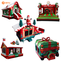 Château gonflable de Noël Ceyu avec auvent imprimé Père Noël, figurines d'elfes, piliers verts et murs en filet pour utilisation en intérieur ou en jardin