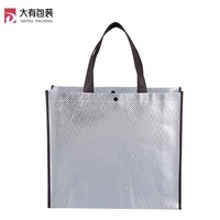 Sac fourre-tout non tissé laminé personnalisé Usine Film laser argenté Style métallique cousu étanche pour le shopping