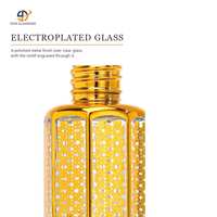 Flacon en verre octogonal en gros pour huiles essentielles avec bouchon à vis et bille roulante pour kits de voyage cosmétiques et présentoirs de vente au détail