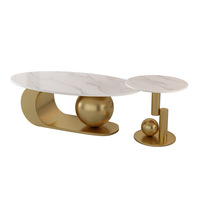 Table basse de luxe de style italien haut de gamme Table à thé en plaque de roche à base de métal doré Table d'appoint basse ovale au design personnalisé
