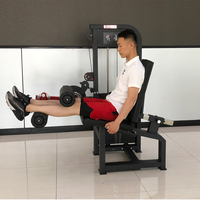 Machine multifonctionnelle professionnelle à charge libre pour salle de sport : Machine à curls et extensions assises, et presse à jambes