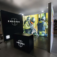 Stan Pameran Peralatan Keamanan Berbentuk L dengan Meja Resepsi Berlampu dan Display Sudut