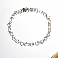 Vente en gros de bracelets à chaîne tendance en forme de cœur en acier inoxydable pour dames et garçons pour les fêtes