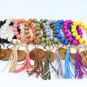 New Trendy Colored Wood Beads Elastic Keyring Bracelet Wholesale For Women Tassel Keychains
