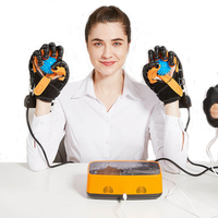 Gants robotisés de rééducation électrique, dispositif d'entraînement des doigts et de la main facile à utiliser pour les patients victimes d'AVC et d'hémiplégie