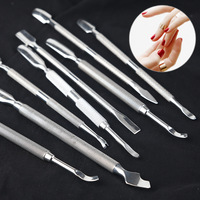Outils de pédicure professionnels pour adultes : Pousse-cuticules et râpe à ongles double tête, durables et portables, pour l'élimination des peaux mortes.