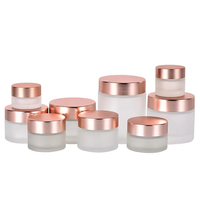 Emballage cosmétique vide OEM en verre givré transparent mat avec couvercle rose doré pour crème pour le visage