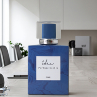 Emballage de bouteille de parfum Boîte d'emballage de parfum bleu carré avec logo personnalisé Bouteille de 30ml 50ml Bouteille en verre noir pour un travail normal