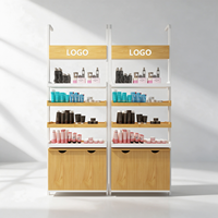 Présentoir cosmétique noir et blanc à bordure jaune, double colonne, avec boîte lumineuse supérieure pour logo