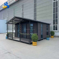 Maison conteneur moderne extensible avec véranda pour bureau, appartement ou hôtel, dotée d'un design élégant en panneaux sandwich