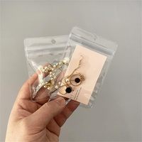 Sacs refermables personnalisés recyclables avec logo, pour bijoux, bagues, boucles d'oreilles, petits emballages, sacs à fermeture éclair en PVC givré avec trou de suspension