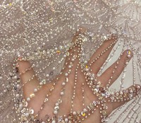 Tissu en dentelle brodée de sequins en gros pour robes de mariée et tenues de mariage