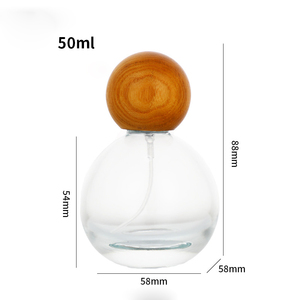 Flacon de parfum en verre transparent rond de haute qualité avec pulvérisateur à chaud de 30 ml, 50 ml, 100 ml et bouchons en <span class=keywords><strong>bois</strong></span> de forme originale - Product Image 6