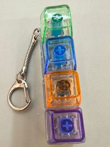 High-transparency Luminous Plastic Square Stress-relief Toy <b>Mechanical</b> <b>Keyboard</b> Keychain with 4-Key Button Cap - Product Image 6