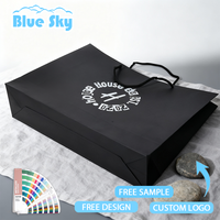 Sac en papier kraft noir épais de qualité supérieure avec poignées en corde ronde, design durable et élégant, idéal pour la vente au détail de luxe, l'emballage de cadeaux