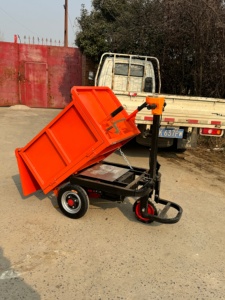 Mini-dumper électrique orange 0,33 mètre cube, design compact, utilisation sur chantier - Product Image 1