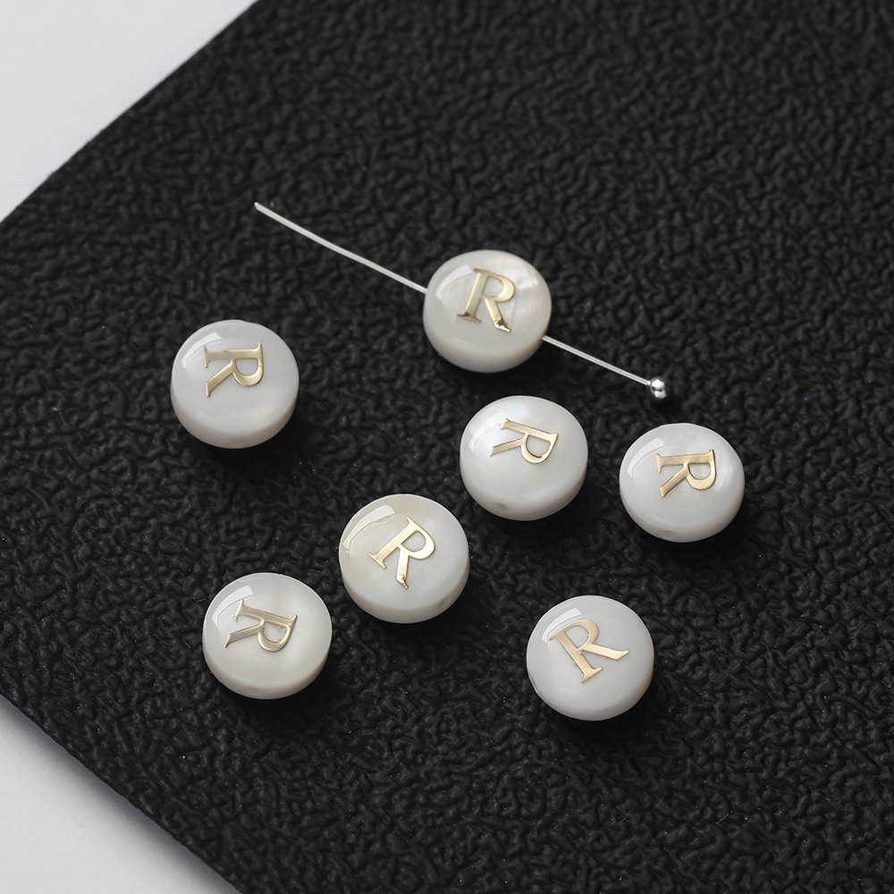 Perles lettres coquillages -- R