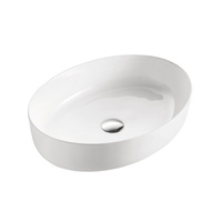 Lavabo de salle de bain en céramique de surface solide de luxe moderne en stock, lavabo ovale à poser sur le comptoir, lavabo en porcelaine pour hôtel