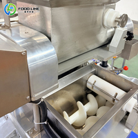 Machine à encruster à vitesse réglable pour la préparation de pâtisseries fourrées de différents types