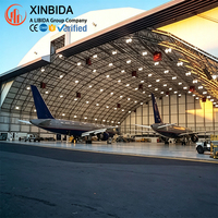 Hangar préfabriqué en acier à grande portée pour le stockage et la révision d'avions, résistant aux vents forts et à la neige, installation rapide sur site