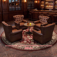 Fauteuil de club vintage européen capitonné avec clous décoratifs, table ronde et ensemble de tapis persan pour bar, bar à cigares, club, hôtel, personnalisable