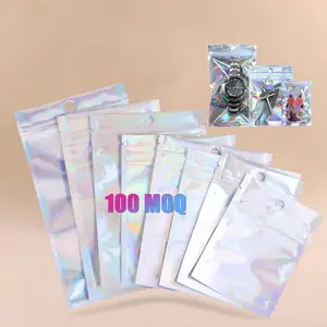 Moq, 100 Uds., 50 Uds., bolsa con cremallera holográfica Instock, ventana transparente, joyería pequeña, pendientes, reloj, bolsa de embalaje de pestañas