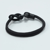 Bracelet en fer tressé simple unisexe Euro-Américain, avec fermoir en U à nœud noir, tendance, mode, luxe léger