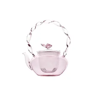 กาน้ำชาดอกไม้แก้วทนความร้อนสูงสีชมพูพร้อมฝาปิดผีเสื้อกาน้ำชาสำนักงาน