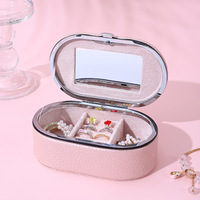 Boîte à bijoux de voyage ovale en cuir, moderne, créative, portable, exquise, pour ranger les bagues, les clous, les pendentifs, les colliers