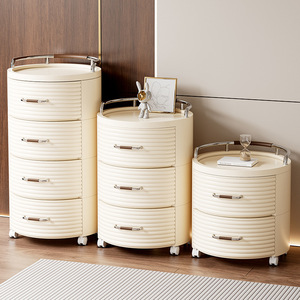 Cream Colored Round Storage Cabinet With Drawers And Wheels For Bedroom Or Living Room Use - Product Image 3