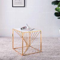 Table basse moderne en acier inoxydable doré et marbre avec placage en titane