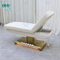 Table de massage de luxe à base dorée, lit pour les cils, salon de beauté, mobilier d'esthéticienne, lit facial incurvé, lit électrique pour les cils, lit cosmétique