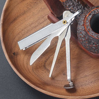 Outil pliant pour tuyaux miniatures 80*10mm en gros |   Broyeur à tabac en métal 3-en-1 avec grattoir et pique |   Vente en gros de produits OEM Yunang pour fumeurs