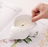 Vente en gros de bougie de luxe en forme de coquille en céramique blanche avec couvercle pour décoration de Noël à la maison cire parfumée