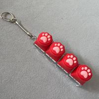 Nouveauté : Porte-clés anti-stress à 4 boutons en forme de patte de chat, mignon, en silicone, sans lumière