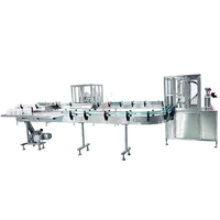 Machine de remplissage et de bouchage automatique pneumatique pour aérosols, pour applications cosmétiques et chimiques