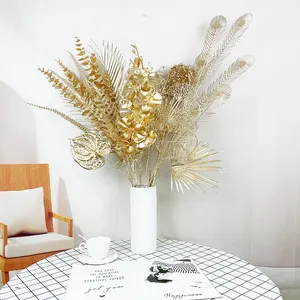 Wholesale gold eucalyptus orchids peacock feather anthurium gold branch lone stem gold leaves artificial flowers home decor