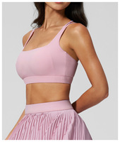 Soutien-gorge de yoga à bretelles croisées et dos élégant avec coussinets amovibles, ultra-doux et respectueux de la peau, haut de fitness très élastique pour femme