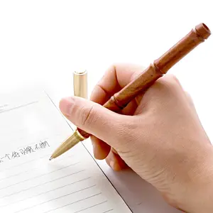 מתנת יום המורה אלגום במבוק מפרק נייטרלי פליז עט משרד חתימה יצירתית עט אוצר כדור עט חריטת לוגו
